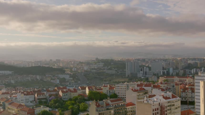 Clouds hover over a city