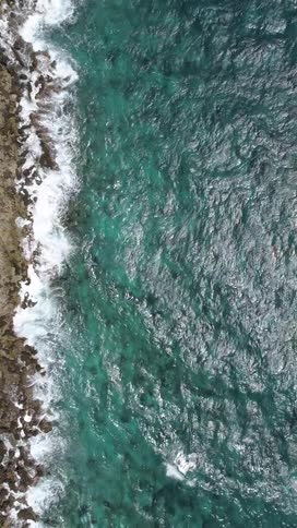 Greenish ocean at the edge of the coast