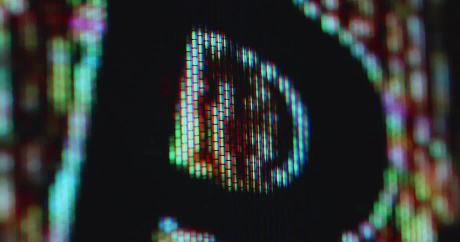 The pixelated RGB panel of a vintage computer monitor flashes as an orange Bitcoin animation symbolizes the computing power of the BTC network based on decentralization and blockchain technology