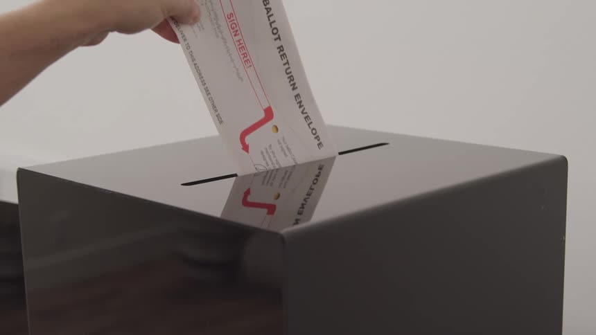 Card being placed inside a metal box