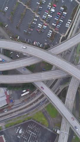 Aerial of different cars moving on the metropolis bridges during the day