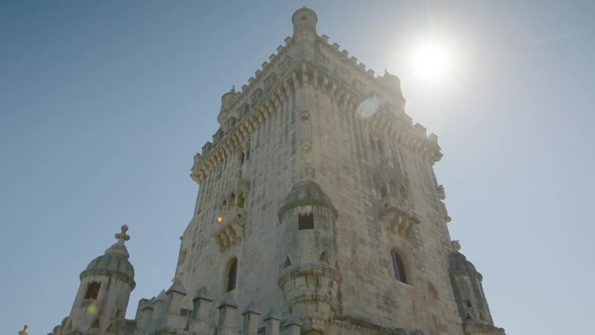 A monument towers into the sunny blue sky