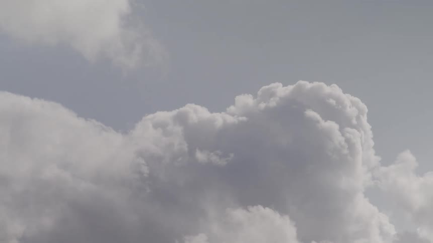 Upward view of moving clouds in the sky