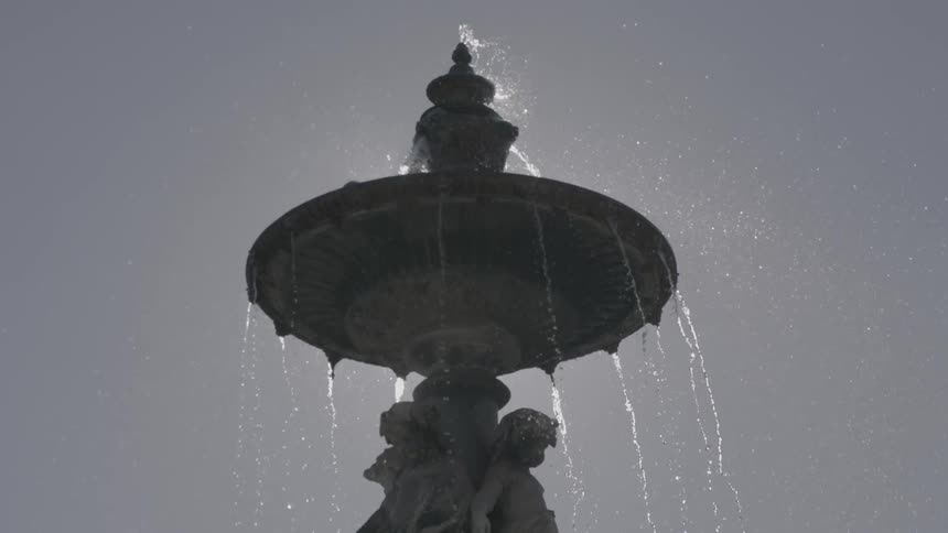 Fountain splashing water down its sides
