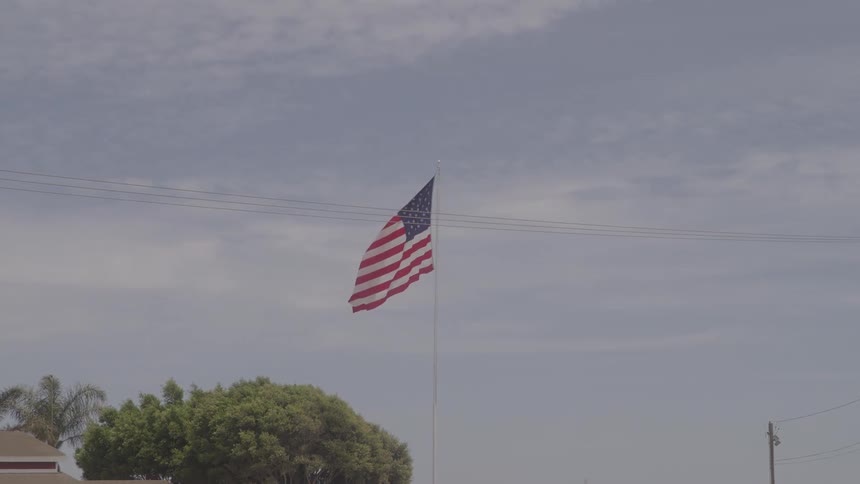 An american flag waves in the breeze