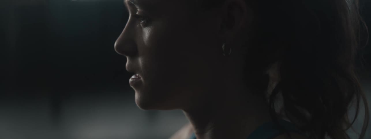 Side portrait of a woman with a determined expression