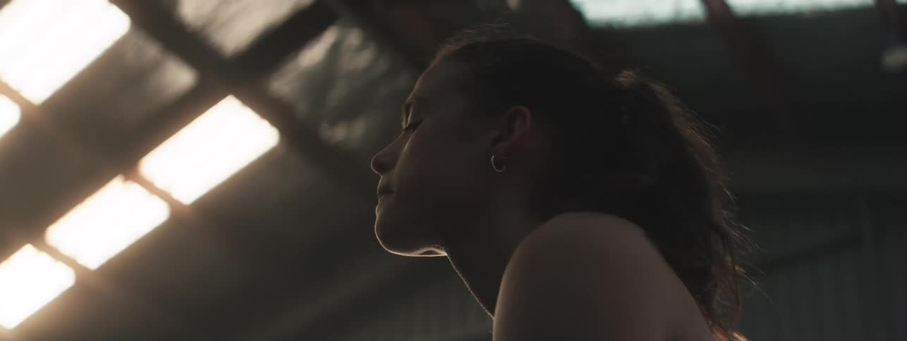 Woman in an indoor environment with a determined expression