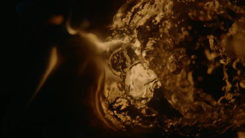 Flames reflect on the surface of water