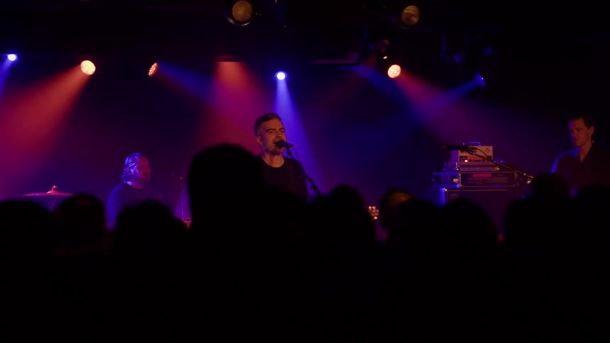 A band is performing for a crowd