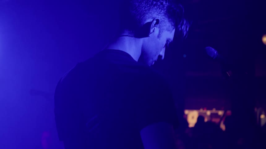 A man playing an instrument at a concert