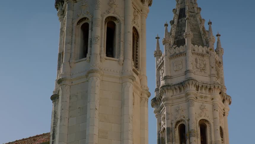 A monument towers into the sunny blue sky
