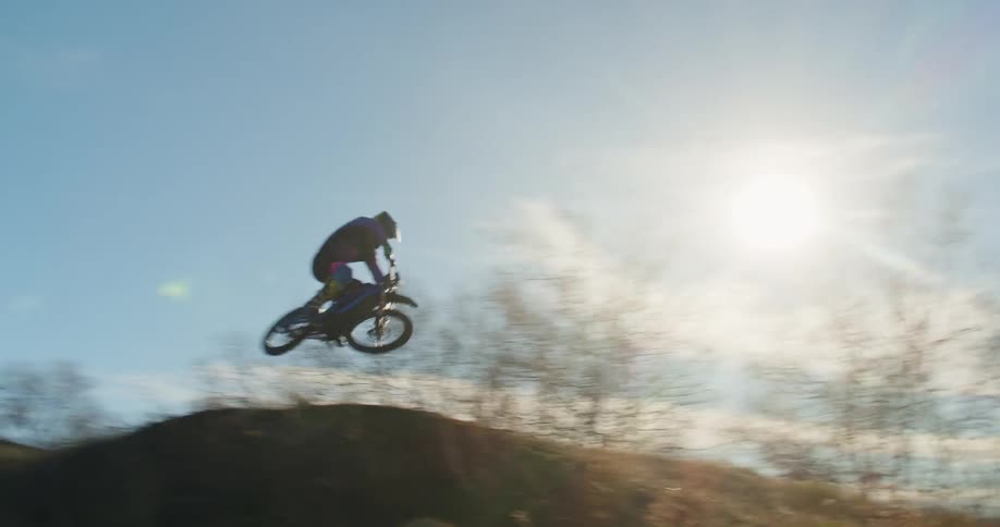 Motocross rider performing a jump