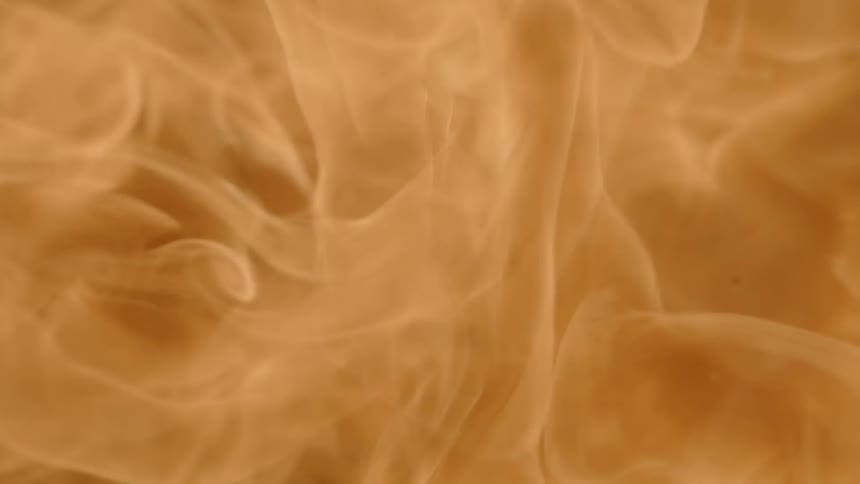 A burst of orange flame against a black background