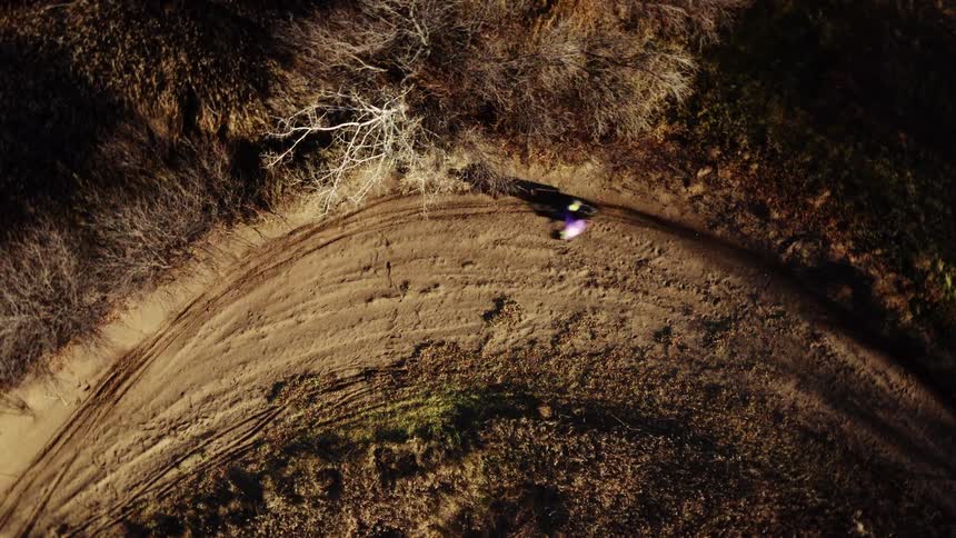 Person making a motocross turn in a natural area