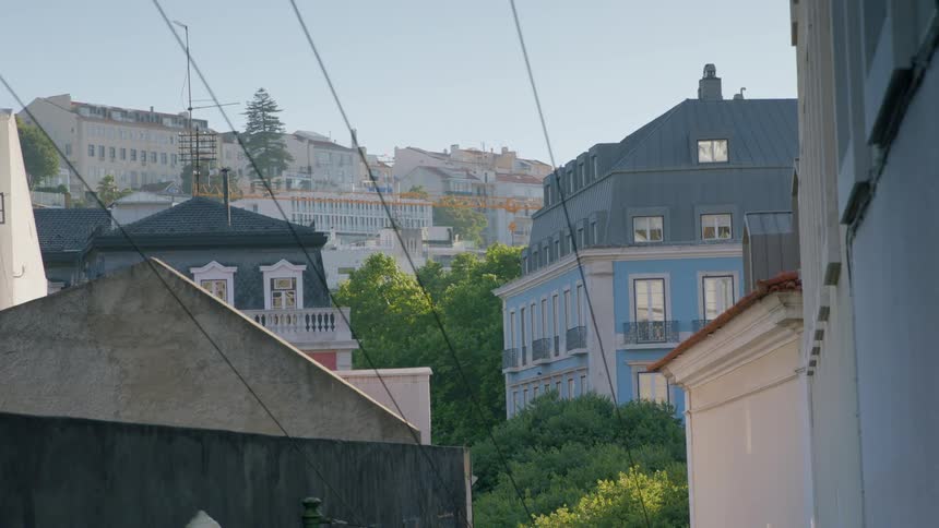Buildings in a town are shown on a sunny day