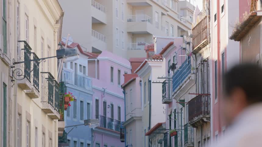 A man walks down a city street