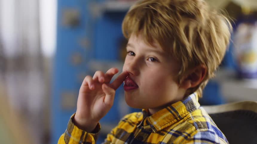 Boy picking out of his nose and putting it in his mouth gets slapped on the hand