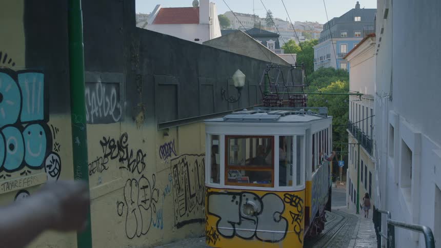 A train goes down the tracks in town