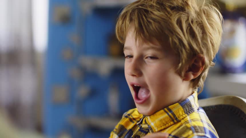Boy picking from his nose and getting slapped on the hand