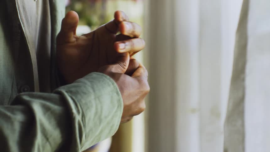 Close up of a pair of hands of a person stretching