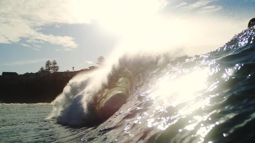 Surfer riding a tubular wave