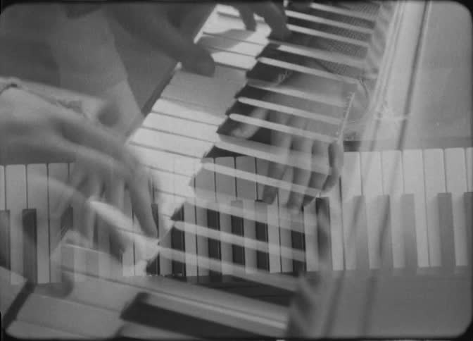 A close up of superimposed images of hands playing a musical keyboard