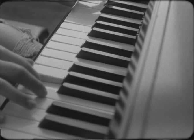 Several superimposed images of a person playing a piano