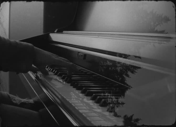 Pair of hands of a person playing piano and trees in multiple exposures