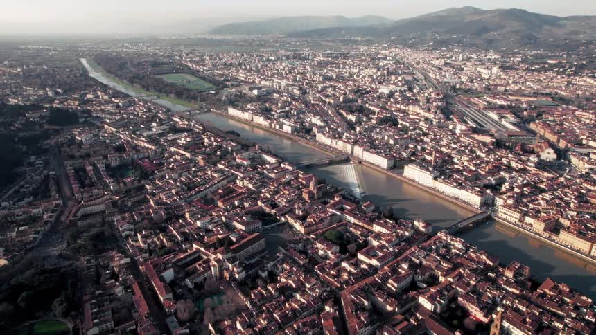 An aerial view of a large city separated by a canal