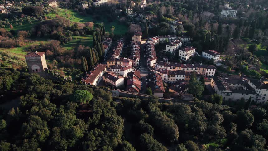 Aerial panorama of a picturesque town in an environment surrounded by trees and mountains