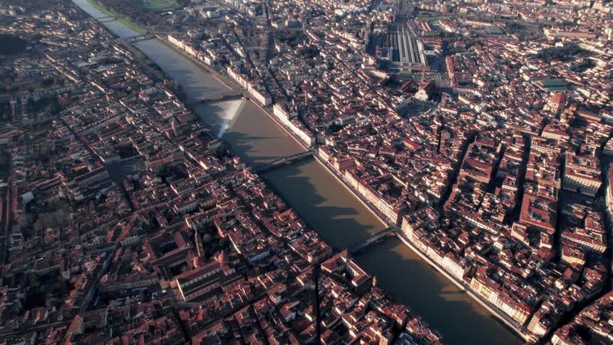An aerial view of a large city separated by a canal