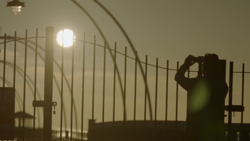 A person is watching the sunset