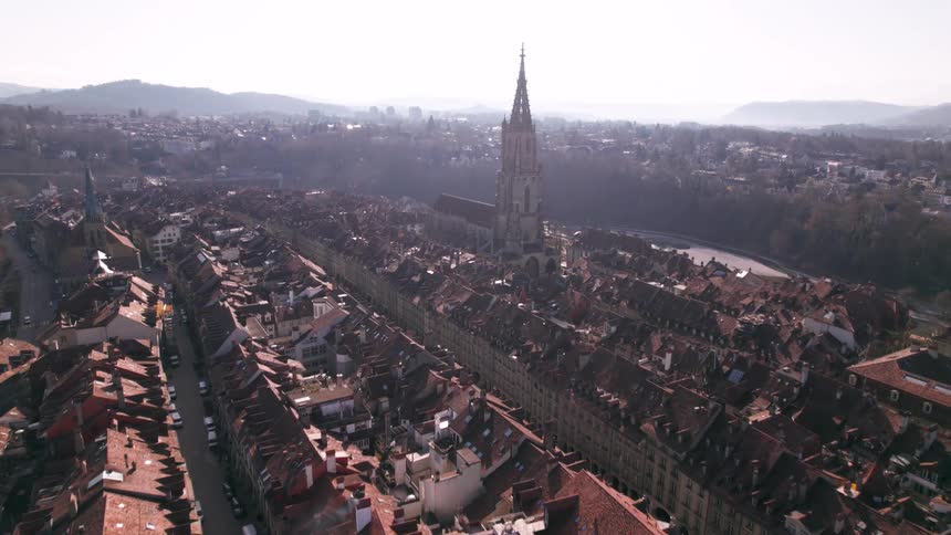 A large city with a huge cathedral rising high into the sky