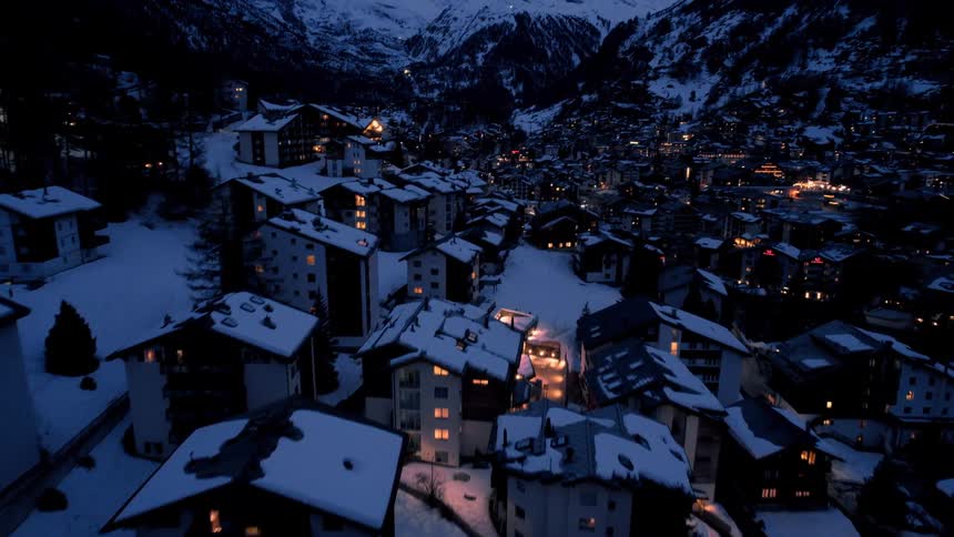 Flying over a winter resort at night
