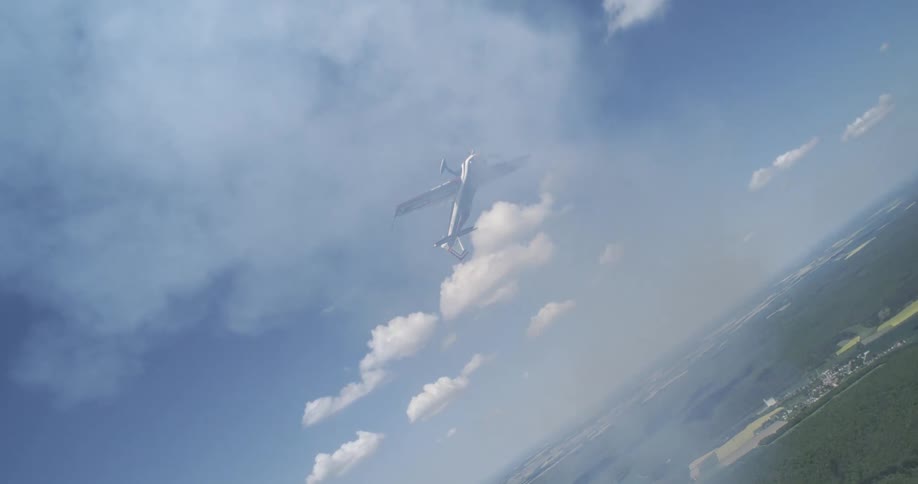 A plane turns in the sky while being surrounded by smoke