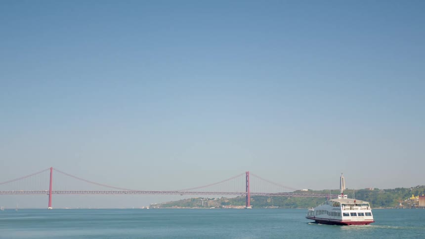 A boat travels across the water on a clear day