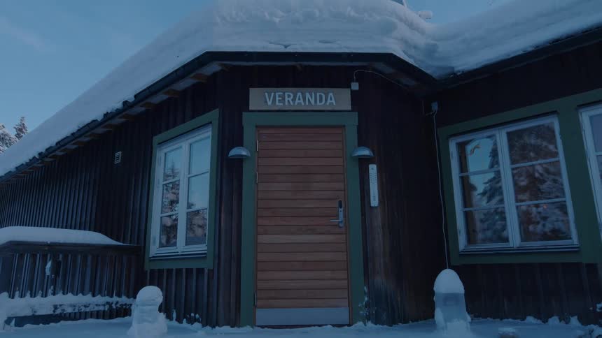 Exterior architecture of a houses front door with a snowcovered roof