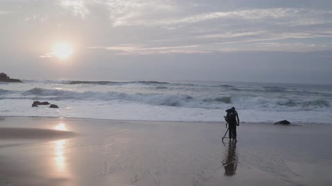Person taking pictures of the beach