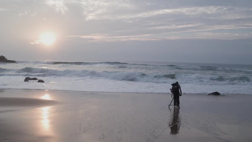 Person taking pictures of the beach