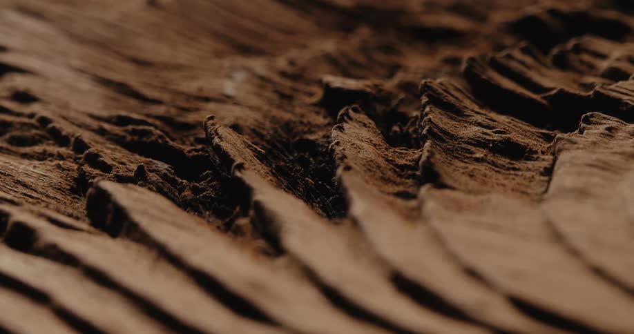 Fine cocoa powder like substance forms a series of crumbly ridges
