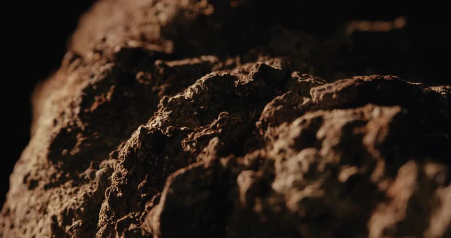 Light shines on the mound of dirt