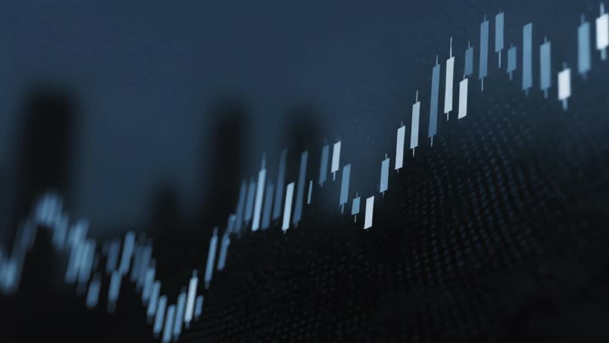 Close up of an electronic screen displaying a trading interface with blue candlesticks against a dark background
