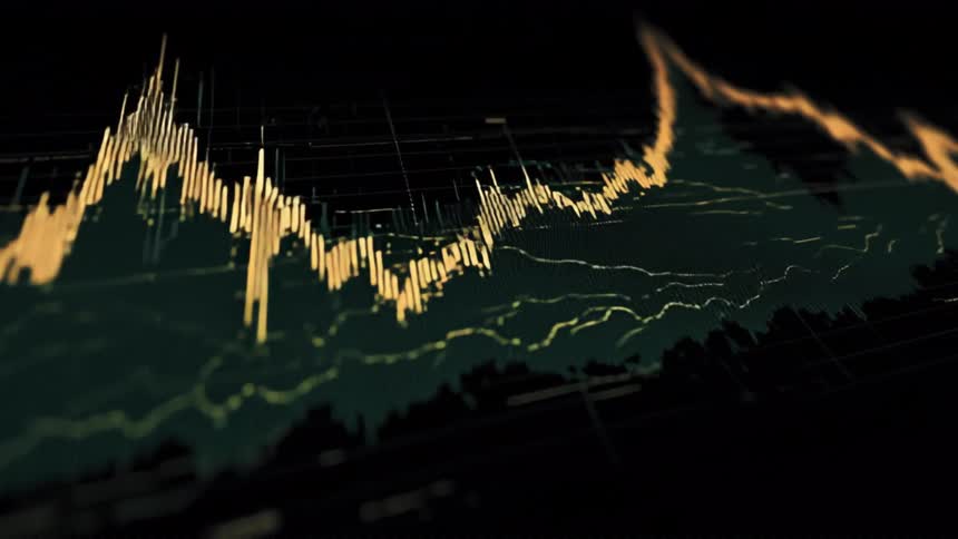 An angled closeup shot captures the dramatic peaks and valleys of a digital financial analytics chart with glowing yellow and green lines