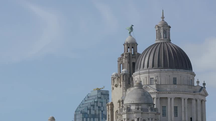 An upper view of a buildings with ornate peaks