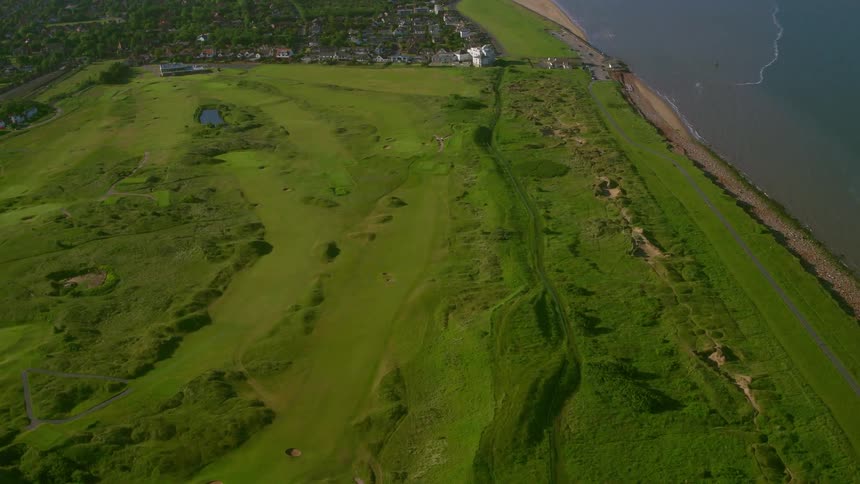 Rolling hills strewn across the shoreline