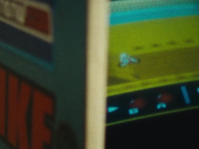 Closeup of an arcade game screen displaying a game