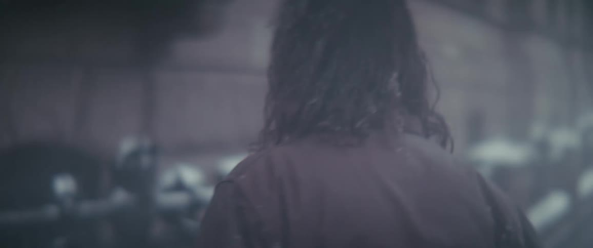 A man walks on the sidewalks of a busy city