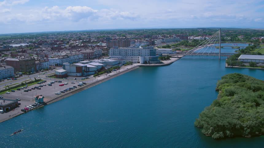 A city near a body of water on a cloudy day