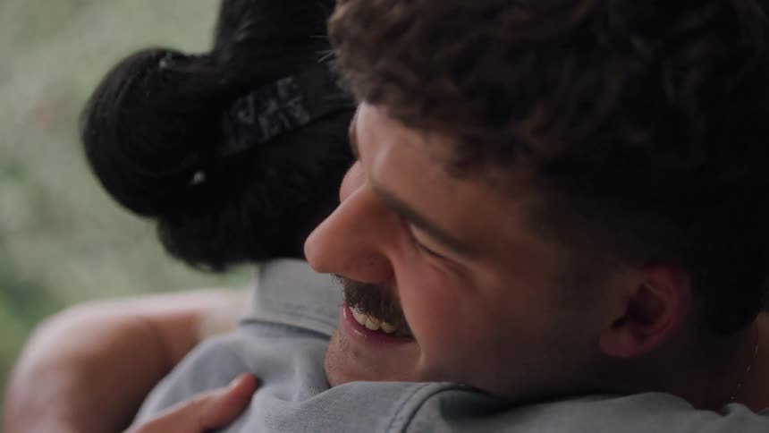Friends hugging each other happily