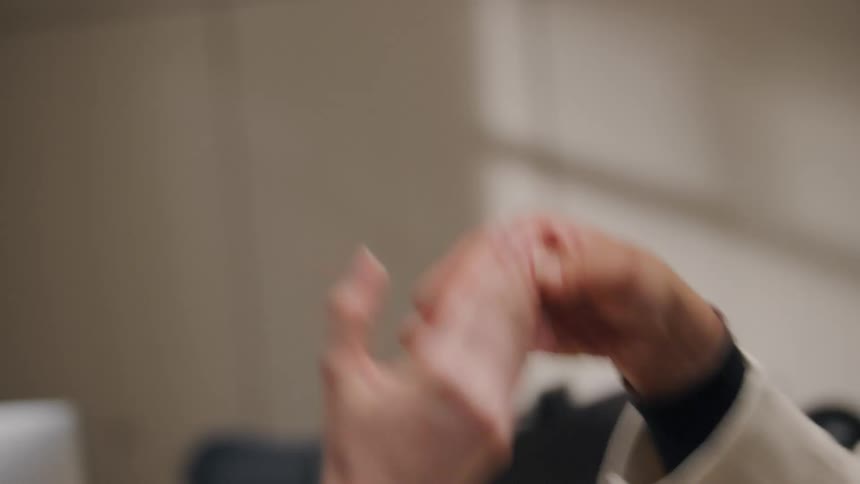 Two friends high five each other during a conversation